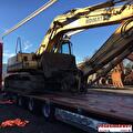 Lading wordt geladen of vastgezet in een trailer van Vroegindewey