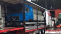 Lading wordt geladen of vastgezet in een trailer van Vroegindewey